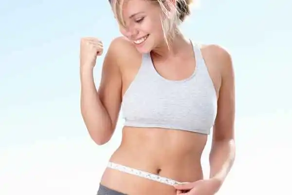 woman happy after fat reduction treatment Kent