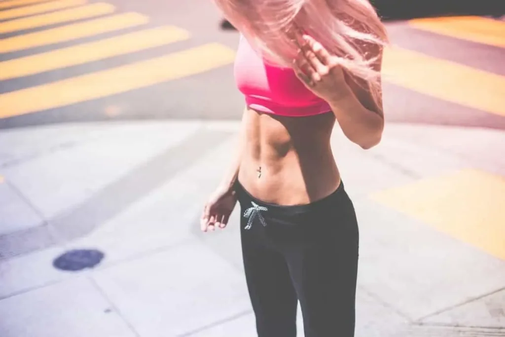 Woman with toned stomach after LA-EMS Body Sculpting Treatment Kent